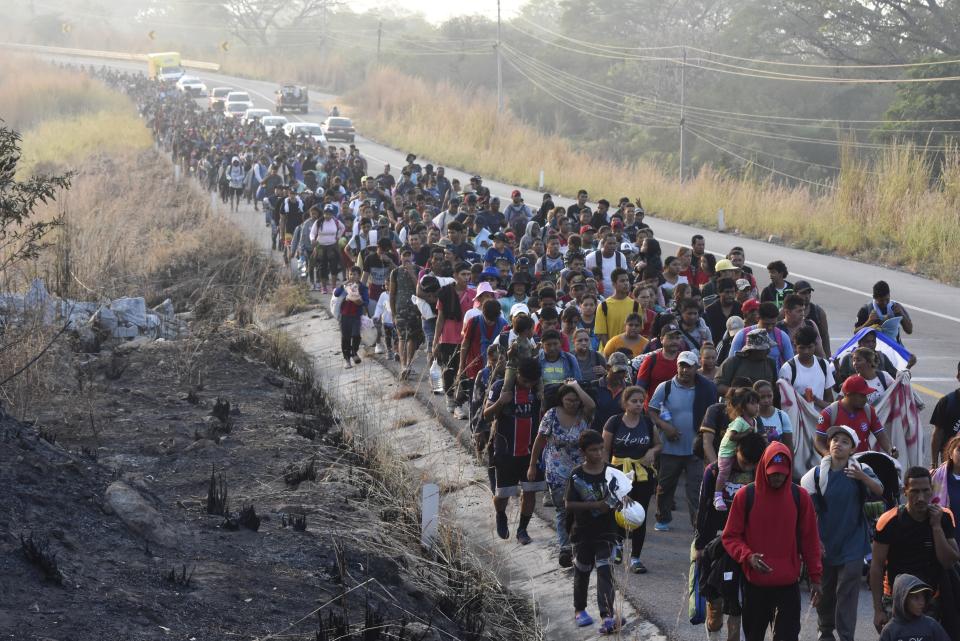 Migrants walk along the highway through Arriaga, Chiapas state in southern Mexico, Monday, Jan. 8, 2024, during their journey north toward the U.S. border. (AP Photo/Edgar H. Clemente)