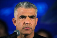 FILE PHOTO: Yair Lapid, head of Yesh Atid party, speaks to supporters during a conference in Holon near Tel Aviv March 12, 2015. REUTERS/Amir Cohen/File Photo