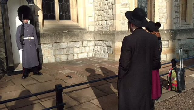 Tourists blasted for throwing glove at Queen's Guard