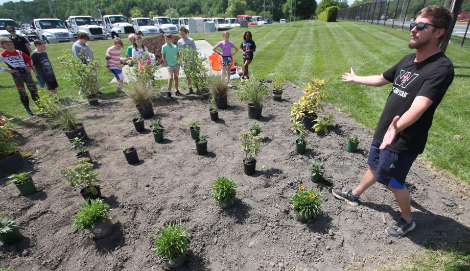 Enviromental Engineer Michael Kedenburg talks to students from Pinewood Elementary School during an Earth Day event held Friday afternoon, April 19, 2024, at Daimler in Mount Holly.