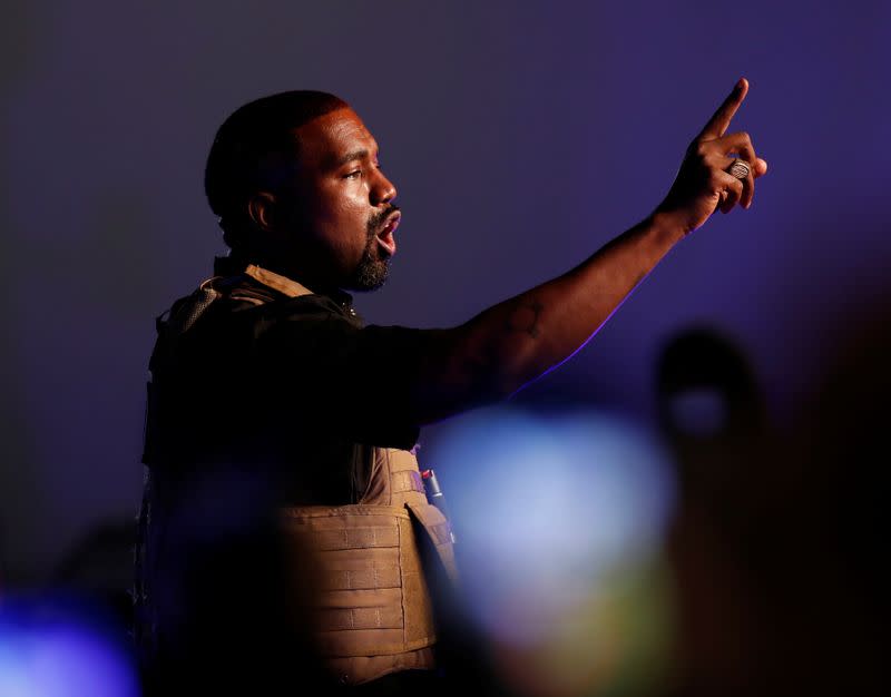 Rapper Kanye West gestures to the crowd as he holds his first rally in support of his presidential bid in North Charleston
