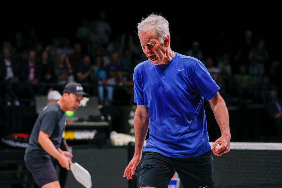 John McEnroe reacts during the Pickleball Slam doubles match against Andre Agassi and Andy Roddick at Hard Rock Live at Seminole Hard Rock Hotel & Casino.