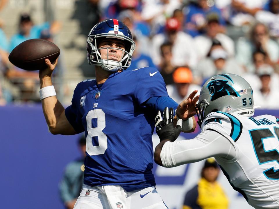 Daniel Jones looks to throw against the Carolina Panthers.