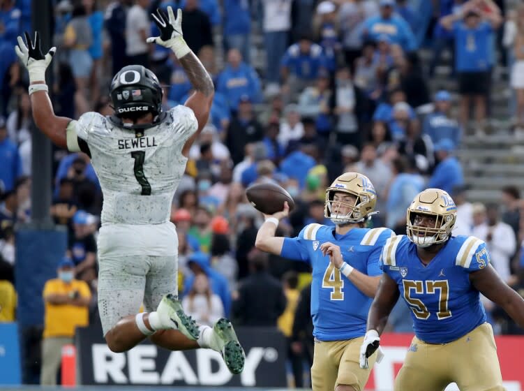 PASADENA, CALIF. - OCT. 23, 2021. UCLA quarterback Ethan Garbers throws a pass against Oregon.