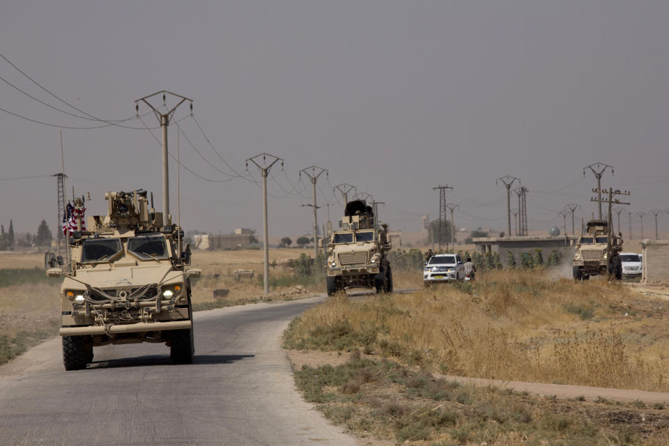 U.S. armored vehicles travel in a joint patrol of the safe zone between Syria and the Turkish border with the Tal Abyad Military Council Tal Abyad, Syria, Friday, Sept. 6, 2019. Once part of the sprawling territories controlled by the Islamic State group, the villages are under threat of an attack from Turkey which considers their liberators, the U.S-backed Syrian Kurdish-led forces, terrorists.T o forestall violence between its two allies along the border it has helped clear of IS militants, Washington has upped its involvement in this part of Syria.. (AP Photo/Maya Alleruzzo)