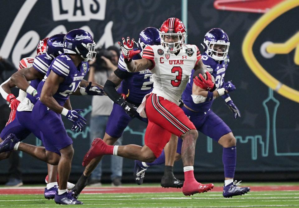 Utah Utes running back Ja’Quinden Jackson (3) looks to stiff arm Northwestern Wildcats defensive back Rod Heard II (24) as Utah and Northwestern play in the SRS Distribution Las Vegas Bowl on Saturday, Dec. 23, 2023. | Scott G Winterton, Deseret News