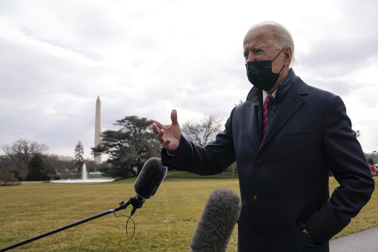 President Joe Biden speaks with reporters before boarding Marine One, Friday, Jan. 29, 2021, in Washington. Biden is traveling to Walter Reed National Military Medical Center. (AP Photo/Evan Vucci)