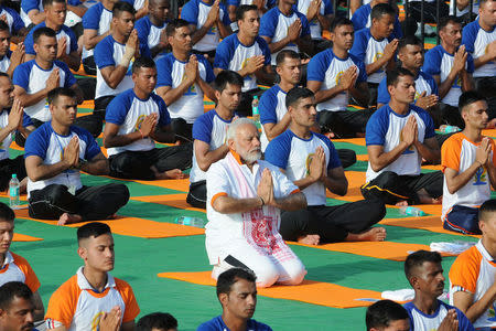 Indian Prime Minister Narendra Modi performs yoga on International Yoga Day in Dehradun in the northern Himalayan state of Uttarakhand, India June 21, 2018. REUTERS/Stringer