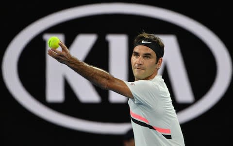 Switzerland's Roger Federer serves to Germany's Jan-Lennard Struff during their men's singles second round match on day four of the Australian Open tennis tournament in Melbourne on January 18, 2018 - Credit: AFP 