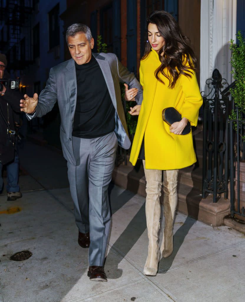 <p>Out for dinner in a yellow coat and high boots.</p>