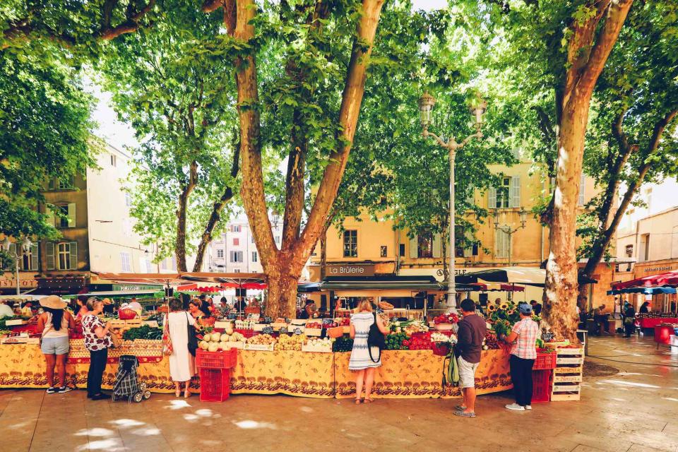 <p>iStockphoto/Getty Images</p> Shoppers at the fruit and vegetable market in Aix-en-Provence.