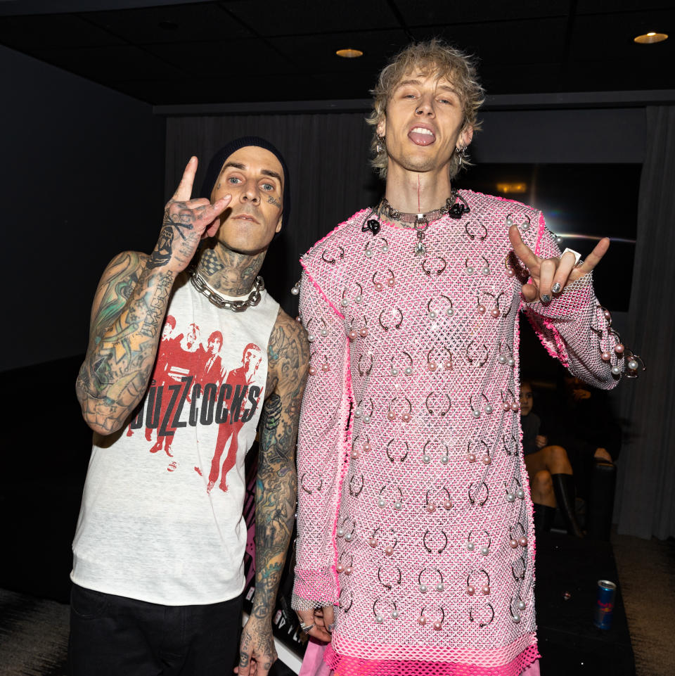 Travis Barker and Machine Gun Kelly are surprised with plaques celebrating the platinum certification of over 1,000,000 copies of the Interscope Records album “Tickets To My Downfall”. at Bud Light Super Bowl LVI Music Fest held at Crypto.com Arena on February 10, 2022 in Los Angeles, California. - Credit: Christopher Polk for Variety
