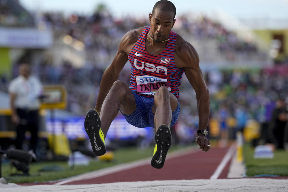 FILE - Christian Taylor, of the United States, competes during qualifications for the men's triple jump at the World Athletics Championships on Thursday, July 21, 2022, in Eugene, Ore. On Friday, Taylor will start his bid to make a third Olympic team. It’s been quite a ride for the 34-year-old whose career also includes four world championship titles and coming within eight centimeters of setting a world record. (AP Photo/David J. Phillip, File)