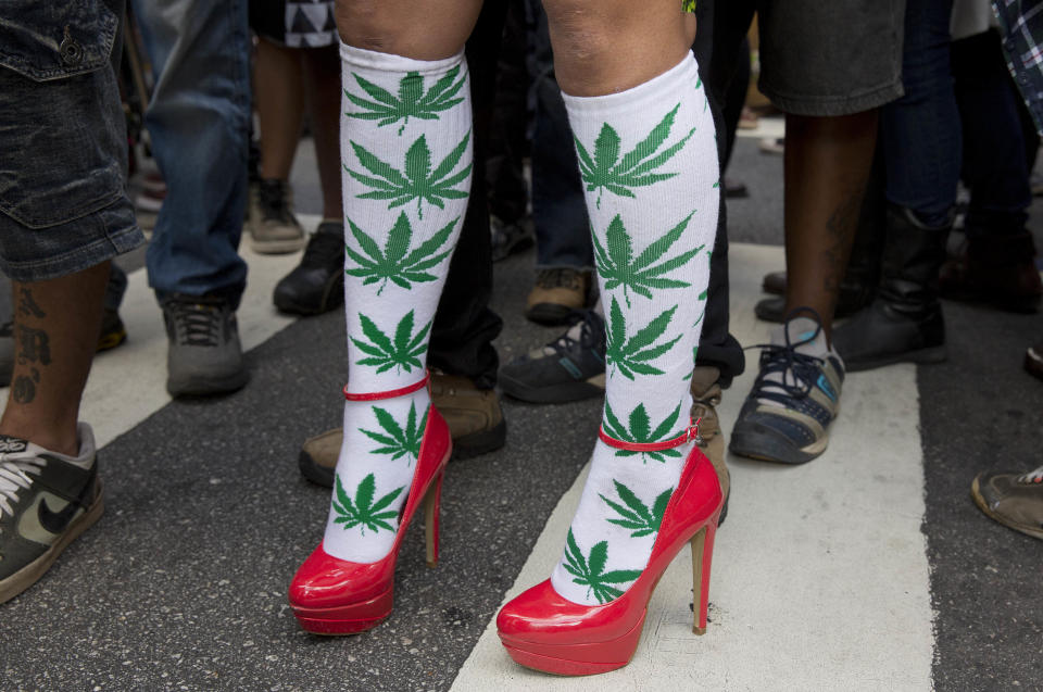 A woman wears socks with drawings of cannabis leaf at a legalization of marijuana march in Sao Paulo, Brazil, Saturday, April 26, 2014. Brazilian police say about 2,000 people have gathered in downtown Sao Paulo in a demonstration demanding the legalization of the production and sale of marijuana in Latin America's largest country. (AP Photo/Andre Penner) (AP Photo/Andre Penner)