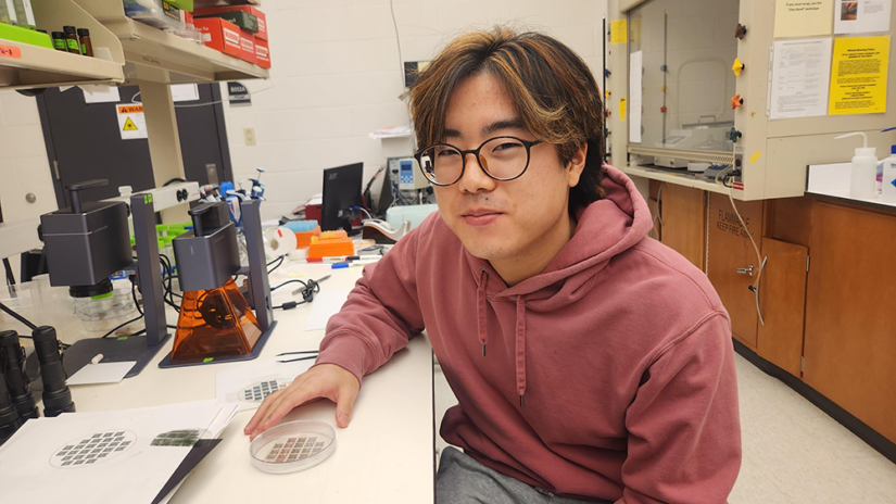Indiana high schooler Joshua Kim in his school’s lab working on his STEM project.