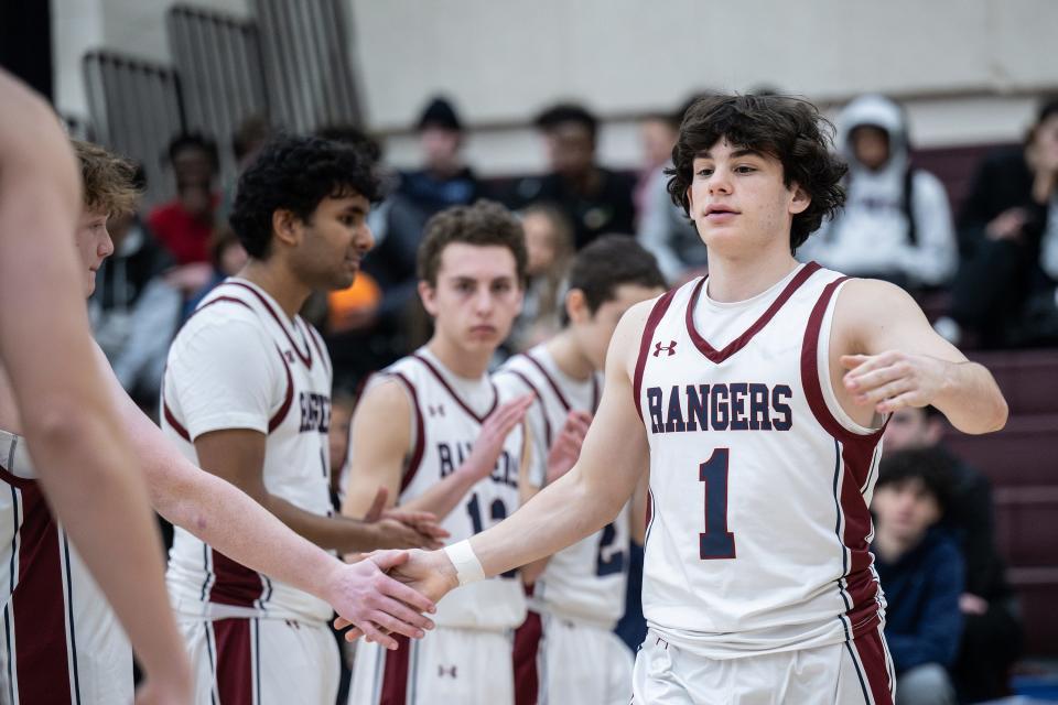 Westborough's Simon Bleier greets teammates during player introductions.