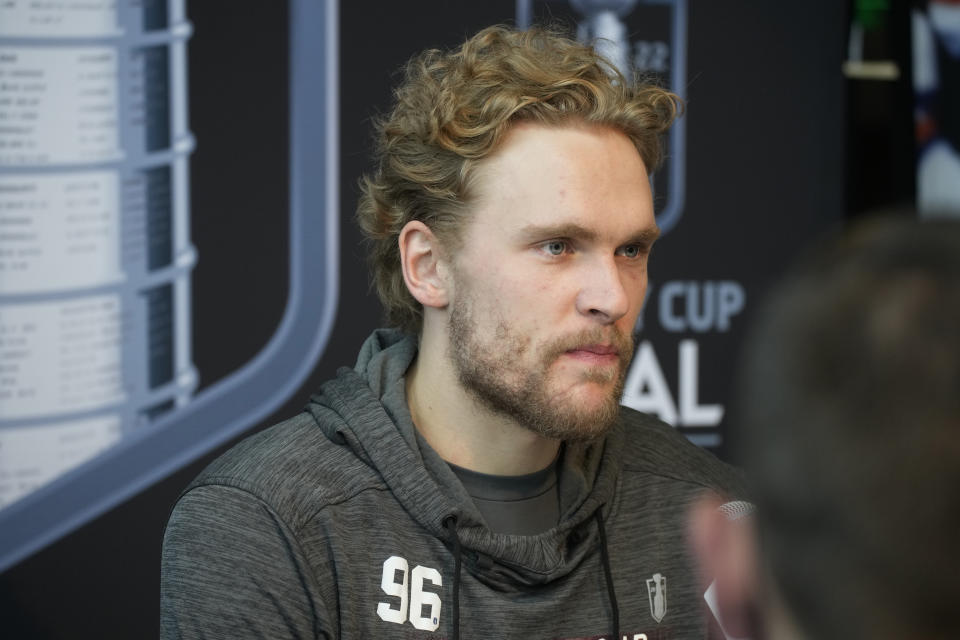 Colorado Avalanche right wing Mikko Rantanen considers a question during media day before Game 1 of the NHL hockey Stanley Cup Finals against the Tampa Bay Lightning Tuesday, June 14, 2022, in Denver. (AP Photo/David Zalubowski)