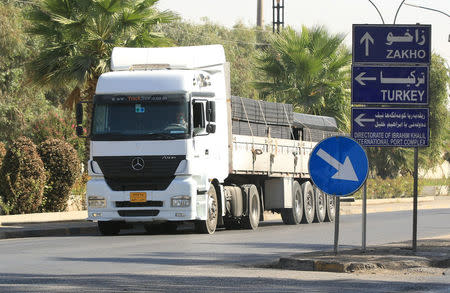 A truck laden with goods from Turkey is seen at the checkpoint of Ibrahim al-Khalil in Zakho, Iraq October 11, 2017. REUTERS/Ari Jalal