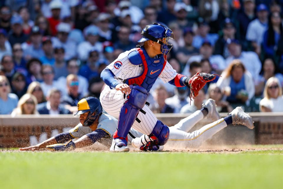 Brewers outfielder Jackson Chourio scores as Cubs catcher Miguel Amaya waits for the ball during the eighth inning at Wrigley Field.