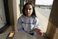 Komalpreet Kaur explains the Vaisakhi holiday during an interview at a coffee shop in Overland Park, Kan., Monday, April 12, 2021. Sikhs across the U.S. are holding toned-down Vaisakhi celebrations this week, joining people of other faiths in observing major holidays cautiously this spring as COVID-19 keeps an uneven hold on the country. Vaisakhi marks the day in 1699 when Sikhism took its current form. (AP Photo/Orlin Wagner)