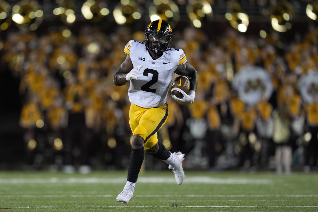 Iowa running back Kaleb Johnson runs with the ball during the second half of an NCAA college football game against Minnesota, Saturday, Sept. 21, 2024, in Minneapolis. (AP Photo/Abbie Parr)