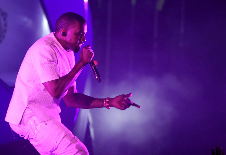 FILE - In this July 1, 2012 file photo, Kanye West performs at the BET Awards in Los Angeles. West’s new album “Yeezus” is an artsy, dark adventure that isn’t easy to digest. The 10 tracks are made up of moody, electronic and erratic beats, and lyrics about race and religion. (Photo by Matt Sayles/Invision/AP, File)