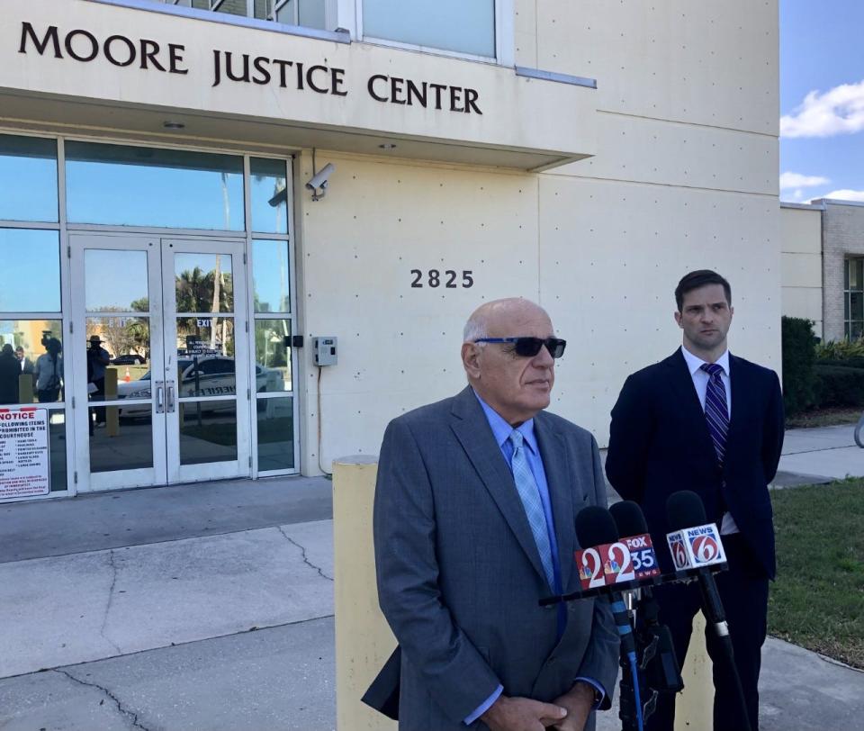 Attorneys Edward Kinberg, left, and Blake Stewart discuss their legal action against Legacy Pools during a news conference Wednesday outside the Harry T. & Harriette V. Moore Justice Center in Viera.