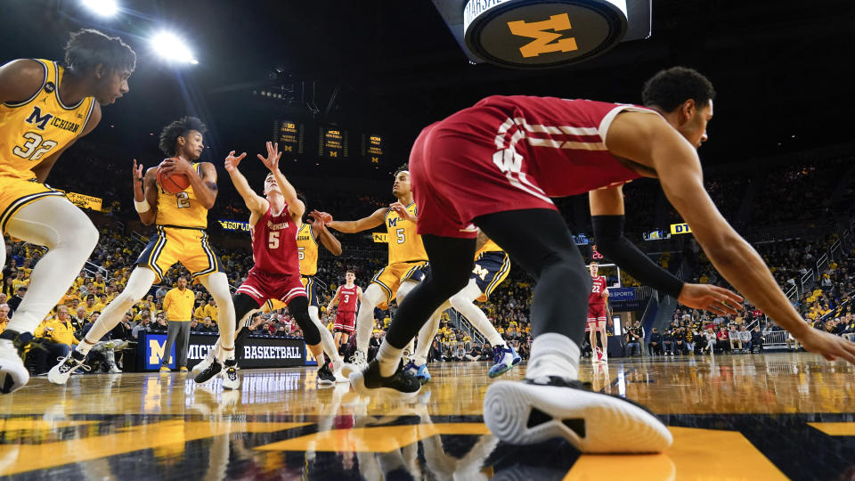 Michigan guard Kobe Bufkin (2) pulls down a rebound against Wisconsin in the first half of an NCAA college basketball game in Ann Arbor, Mich., Sunday, Feb. 26, 2023. (AP Photo/Paul Sancya)