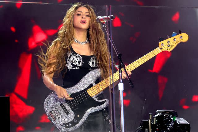 <p>Kevin Mazur/Getty</p> Shakira performs in Times Square in New York City on March 26, 2024