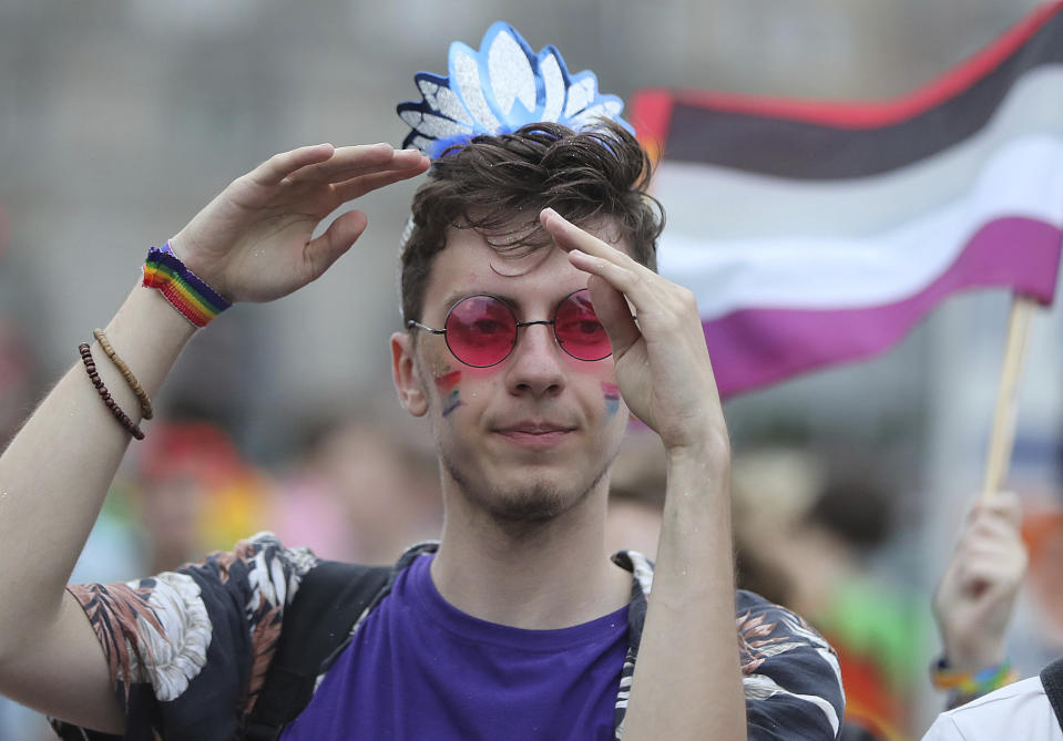 A man takes part in a gay pride parade in Warsaw, Poland, on Saturday, June 8, 2019. The Equality Parade is the largest gay pride parade in central and Eastern Europe. It brought thousands of people to the streets of Warsaw at a time when the LGBT rights movement in Poland is targeted by hate speeches and a government campaign depicting it as a threat to families and society. (AP Photo/Czarek Sokolowski)
