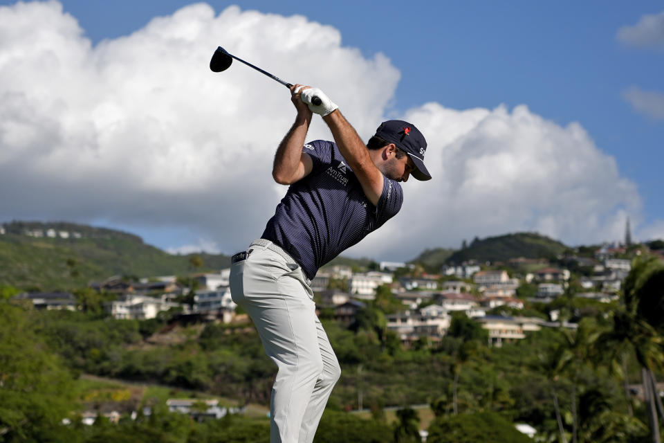 Taylor Montgomery hits from the 14th tee during the first round of the Sony Open golf event, Thursday, Jan. 11, 2024, at Waialae Country Club in Honolulu. (AP Photo/Matt York)