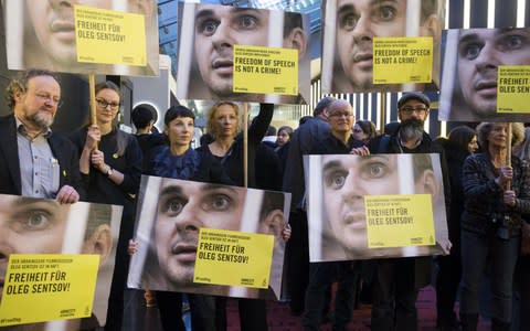 Well-known actresses and others call for Oleg Sentsov's freedom at a rally during the Berlin film festival in February. He has since begun a hunger strike - Credit: Mehmet Kaman/Anadolu/Getty Images