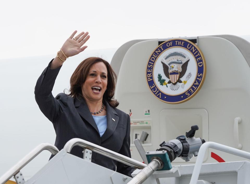 Vice President Kamala Harris waves goodbye as she boards Air Force Two at Detroit Metropolitan Wayne County Airport in Romulus after speaking at the TCF Center in downtown Detroit on Monday, July 12, 2021.