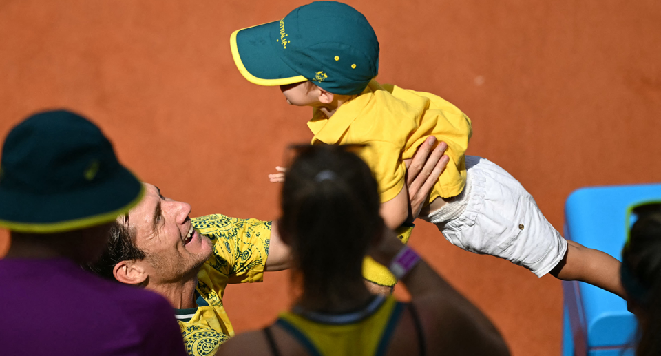 Matt Ebden is seen here embracing his son after winning through to the men's doubles final in tennis with Aussie teammate John Peers. Pic: Getty