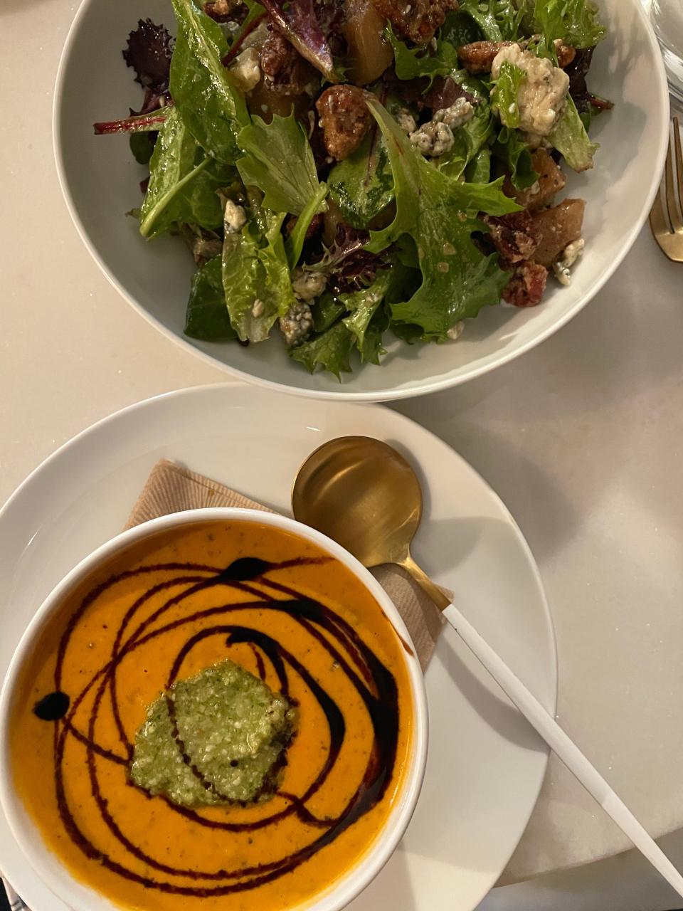 The roasted tomato bisque was topped with a dollop of pesto and a balsamic drizzle, and the mixed greens salad featured roasted peaches, candied pecans, gorgonzola and honey basil dressing.
