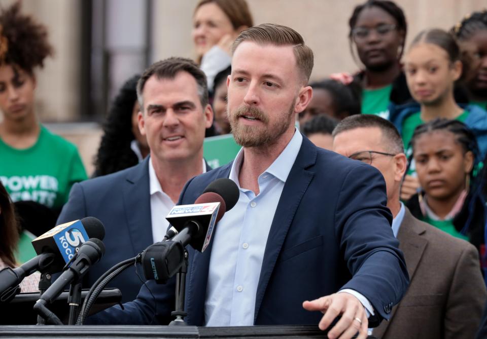 Gov. Kevin Stitt watches as state schools Superintendent Ryan Walters leads at a pro-school choice rally Thursday on the south steps of the Oklahoma state Capitol.