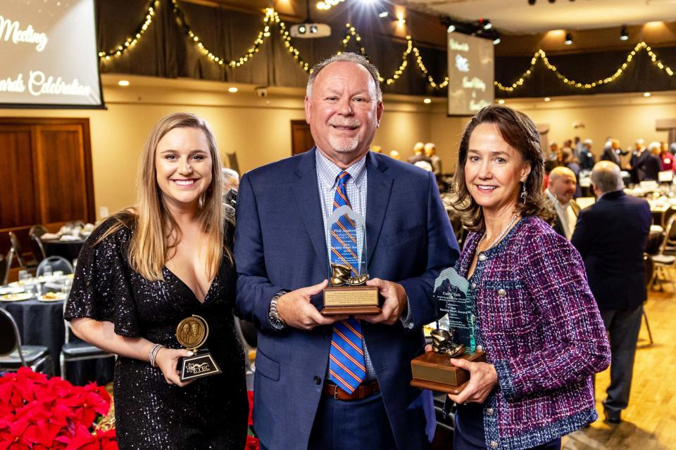Kylie Julius-Schumaker, from left, Postma Young Professional Award winner, poses with Muddy Boot Award winners Phil Andrews and Cathy Toth at the East Tennessee Economic Council's annual meeting and awards celebration in Knoxville on Dec. 8, 2023.