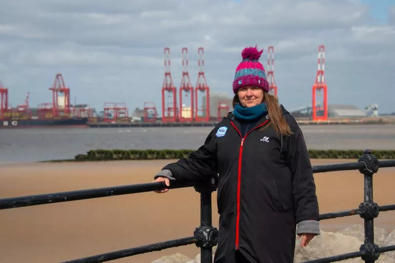 Hilary Hart in front of New Brighton beach