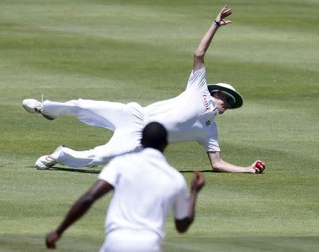 South Africa's Kagiso Rabada celebrates as Chris Morris takes a catch to dismiss England's Alistair Cook (not in picture) during the second cricket test match in Cape Town, South Africa, January 2, 2016. REUTERS/Mike Hutchings