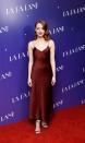 <p>At a screening of ‘La La Land’, Emma worked one of her best looks to date: a slinky slip dress that offset her complexion and hair colour beautifully. [Photo: Getty] </p>