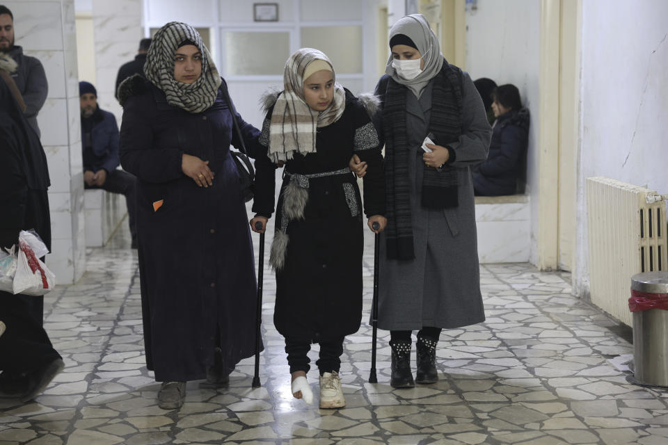 Yasmine Shahoud arrives for physical therapy at a hospital in Idlib, Syria, Wednesday, Jan. 31, 2024. Yasmine was seriously injured and lost all of her immediate family in an earthquake in an earthquake that hit Syria and Turkey in February 2023. (AP Photo/Ghaith Alsayed)