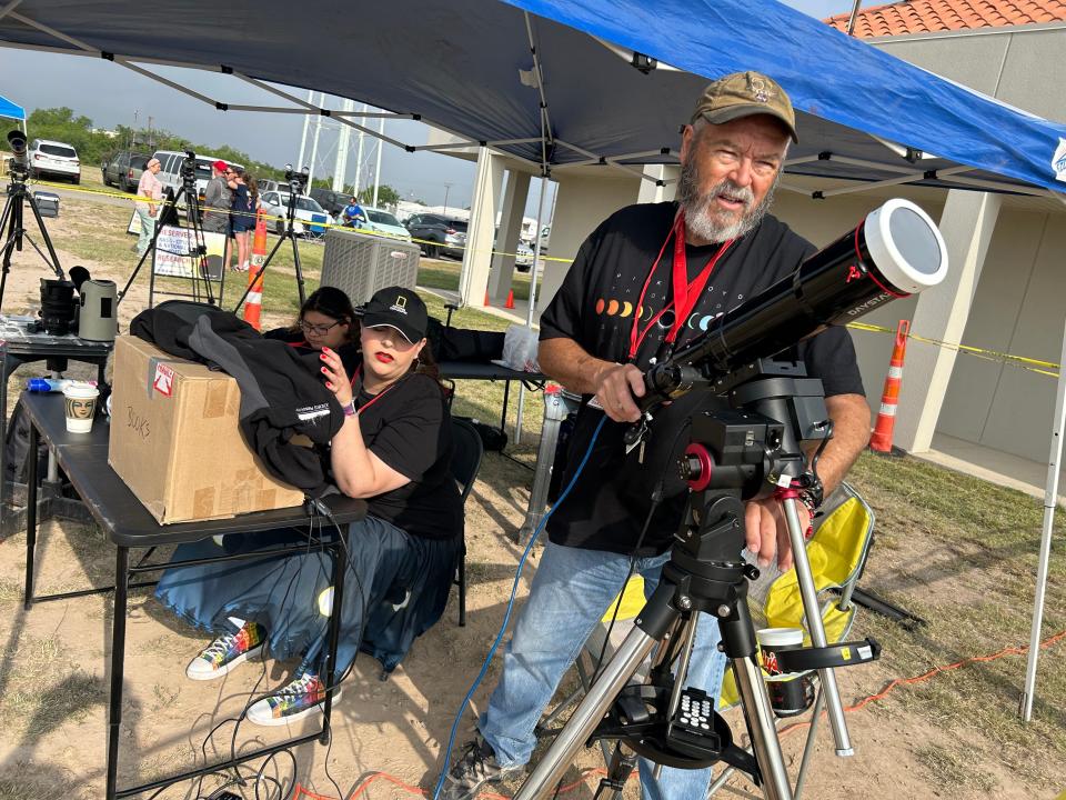 Bobby Greeson, right, a professor at Sul Ross State University, and Alejandra Martinez, a seventh grade science teacher, calibrate a telescope in Eagle Pass Monday minutes before the total solar eclipse. They were part of a team of science enthusiasts across the USA who helped record the eclipse's path for NASA.