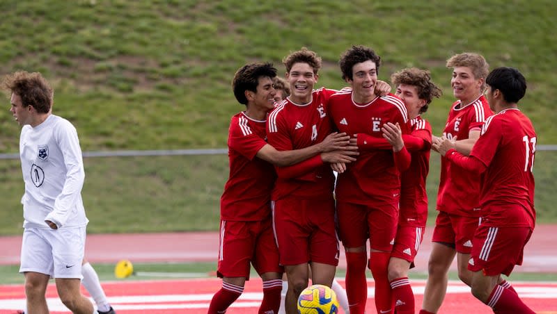 East Leopards defender Khristian Bombeck (8) is congratulated by teammates after he makes a goal during a game against the Brighton Bengals at East High School in Salt Lake City on Tuesday, May 7, 2024.