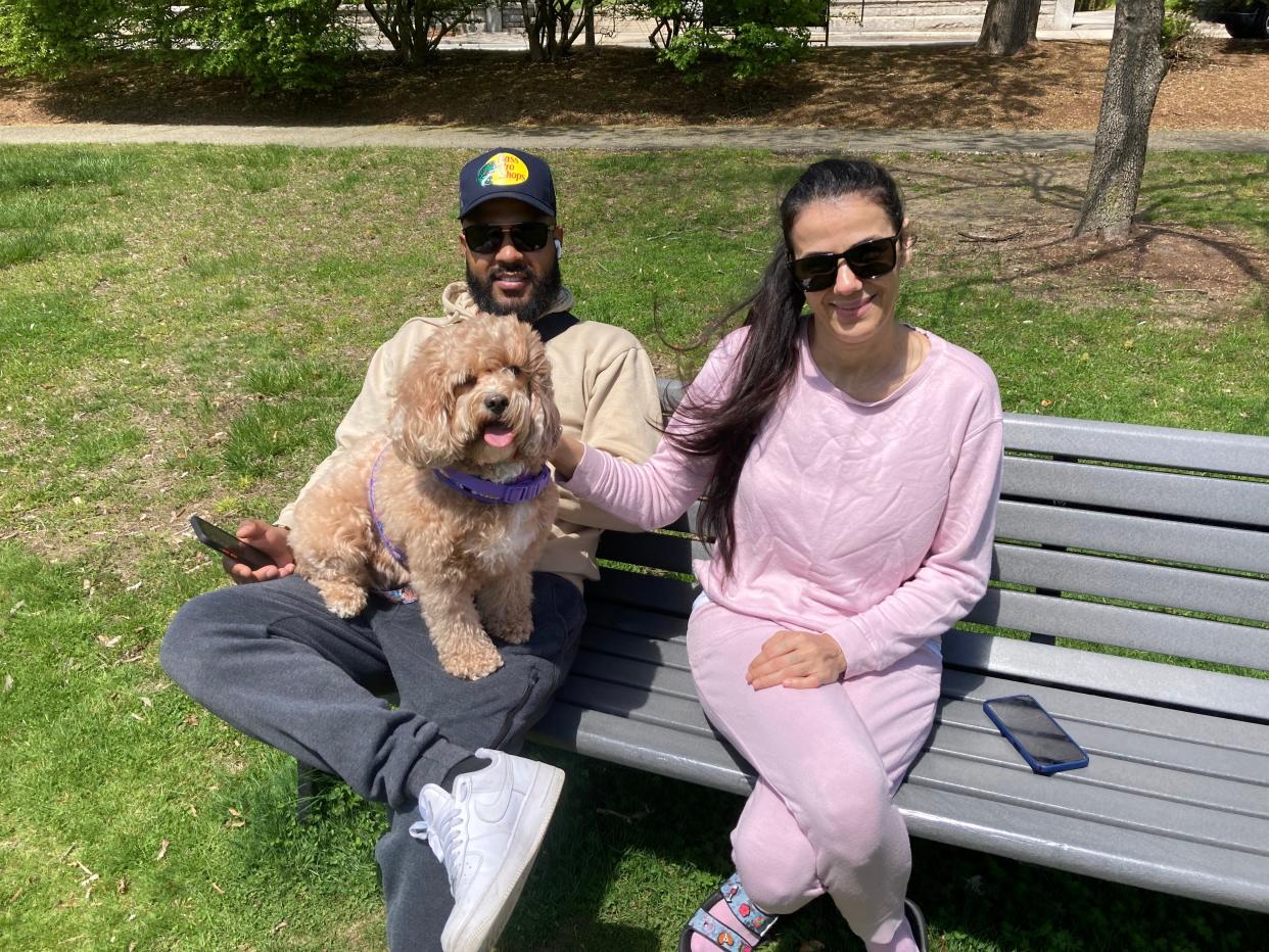 Alex and Millie Robles with their poodle, Mia, Saturday at Northbridge Common.