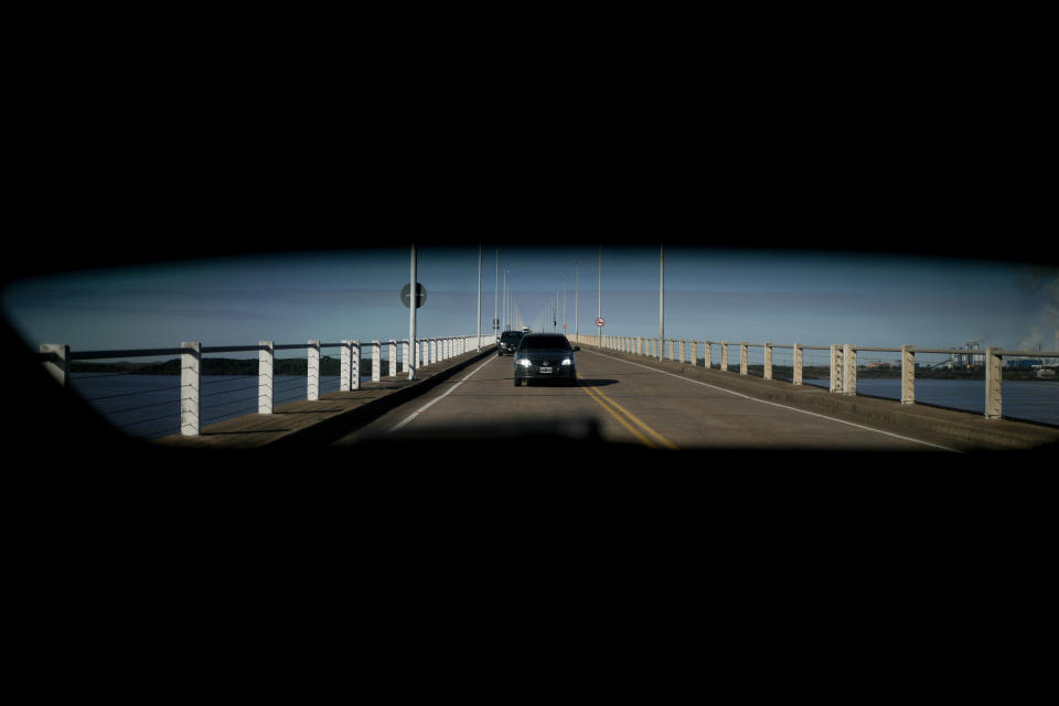 A car crosses the Uruguay River on Libertador General San Martín bridge from Uruguay on its way to Gualeguaychu, Argentina, Saturday, July 1, 2023. Uruguayans are crossing the border to Argentina for shopping bargains created by different exchange rates in the South American countries as crisis-battered Argentina’s peso has plunged against the U.S. dollar and its annual inflation tops 100%, one of the highest rates in the world. (AP Photo/Natacha Pisarenko)