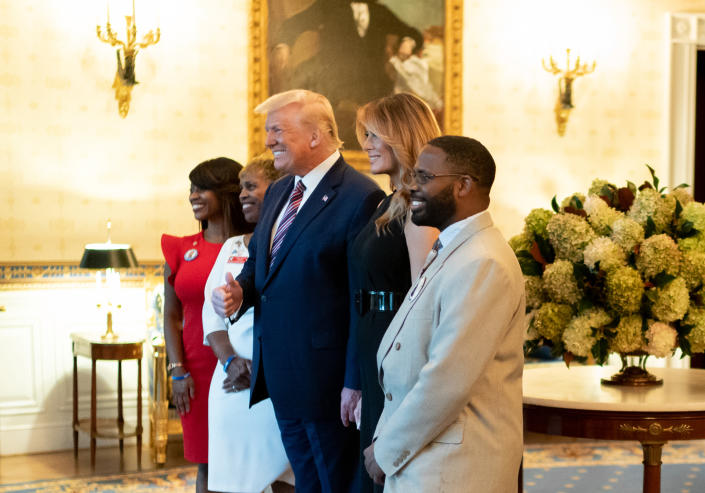 The family of Jesse Melton III poses for a photo with Donald Trump and Melania Trump during a reception for Gold Star families at the White House on September 27, 2020. 