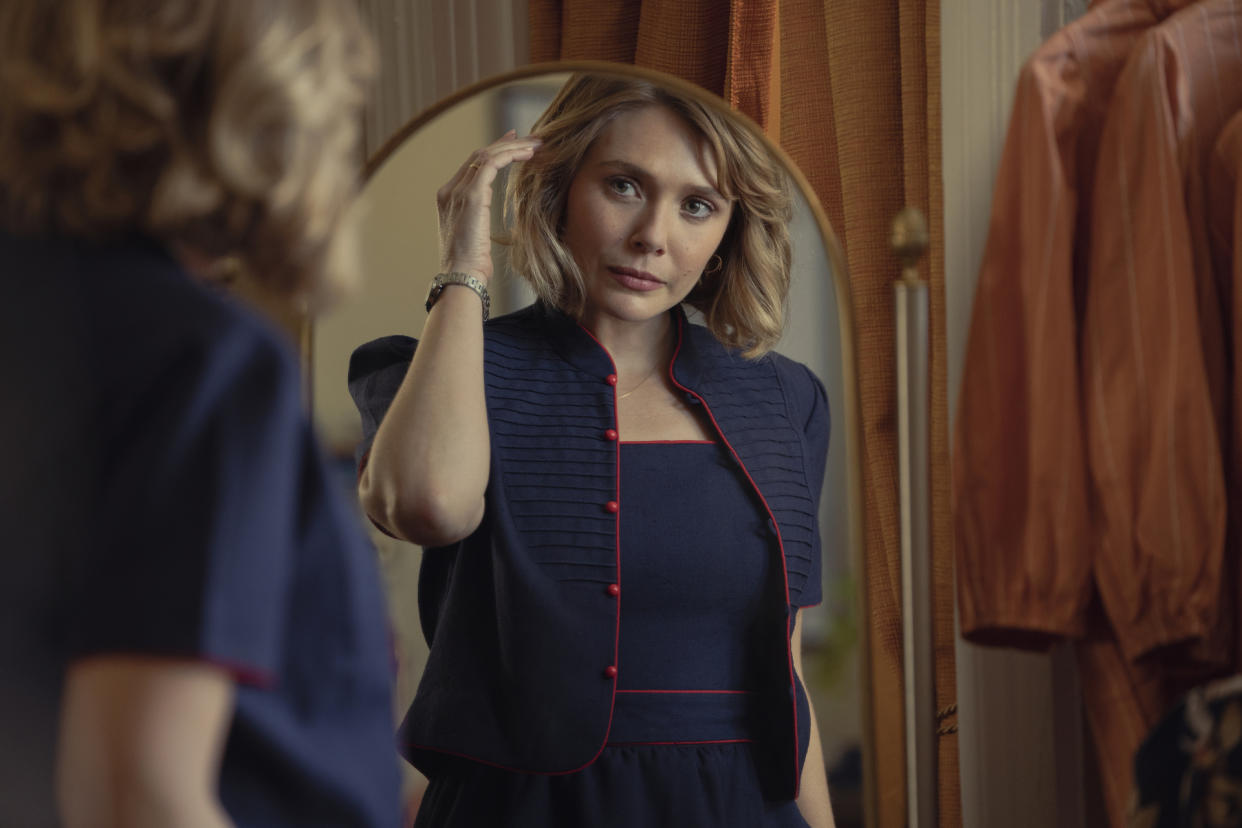 Elizabeth Olsen looking in a mirror