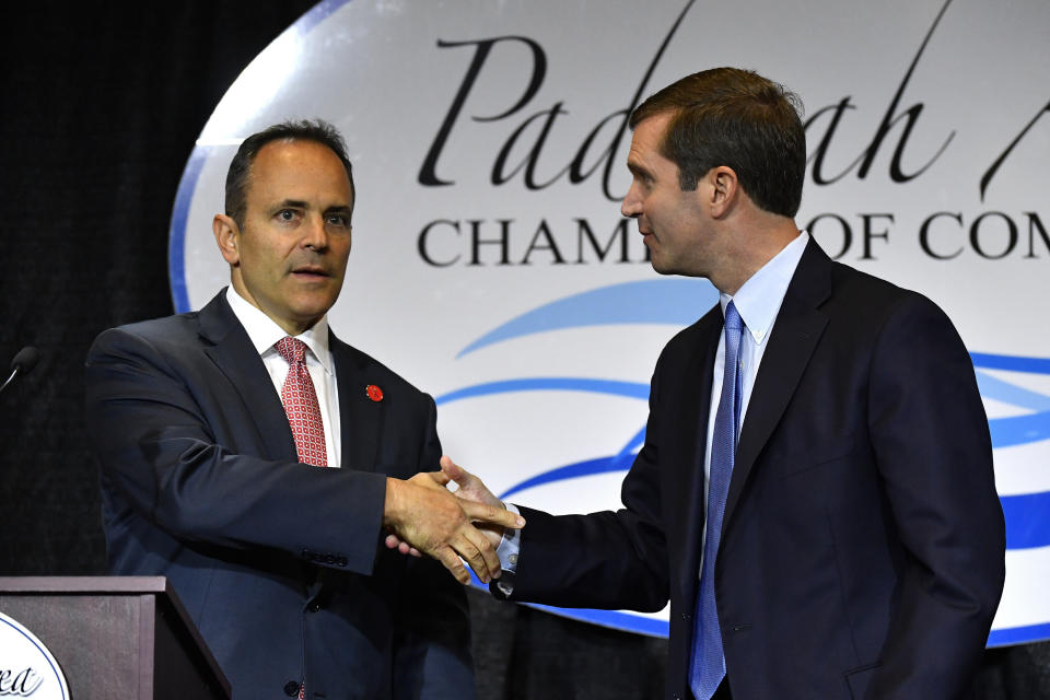 FILE - In this Thursday, Oct. 3, 2019 file photo, Kentucky Governor and Republican candidate Matt Bevin, left, shakes hands with Attorney General and Democratic candidate Andy Beshear before the start of a gubernatorial debate in Paducah, Ky. Looking to pull the plug on one of Democrat Andy Beshear’s campaign themes, two top Republican lawmakers said Thursday, Oct. 17, 2019 that any effort to legalize casino gambling would be “dead on arrival” in the Senate. (AP Photo/Timothy D. Easley, File)