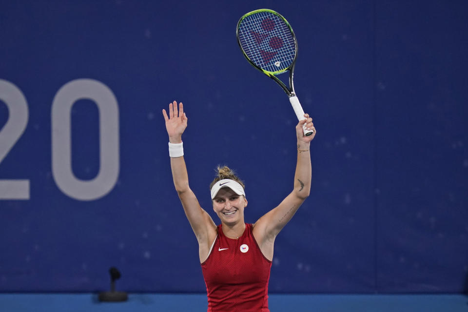 Marketa Vondrousova, of the Czech Republic, reacts after defeating Naomi Osaka, of Japan, during the third round of the tennis competition at the 2020 Summer Olympics, Tuesday, July 27, 2021, in Tokyo, Japan. (AP Photo/Seth Wenig)