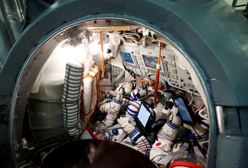 Cosmonaut Alexander Misurkin and space flight participants Yusaku Maezawa and Yozo Hirano attend a training session ahead of the expedition to the ISS, in Star City